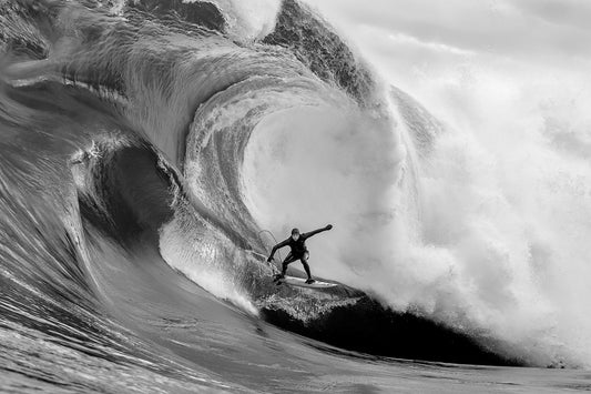 Big wave mutant with surfer wearing the O'Neill FireX wetsuit and O'Neill booties, gloves and hood