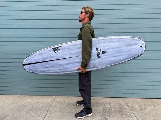 Daniel Tomo Thomson with Revo Max surfboard in Volcanic construction