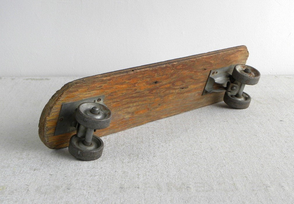 1960S home made skateboard with roller skate parts