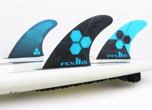 FCS Al Merrick thruster fin set in a surfboard in cobalt blue and black colourway