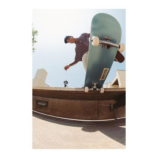 Globe sponsored skateboarder doing a tail stall on his Globe Goodstock complete skateboard