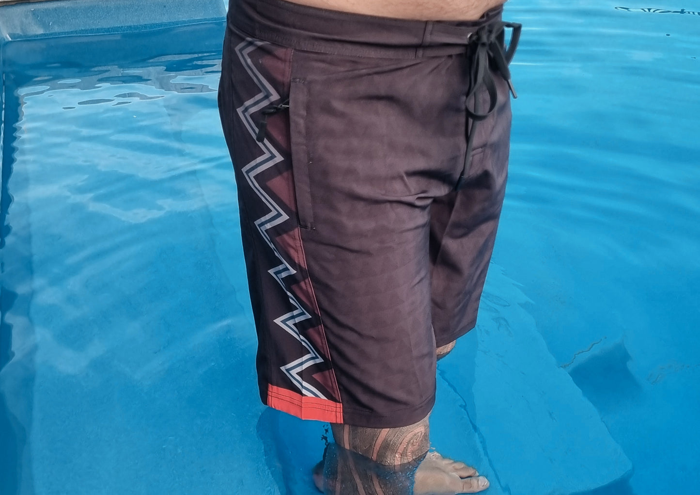 Wai-Tai Aotearoa Taniwha 4 Way Stretch Maori Boardshorts from right side showing taniko pattern