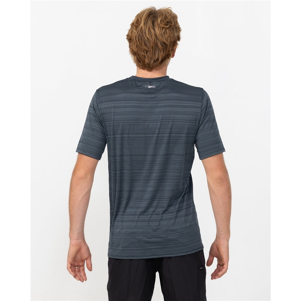 O'Neill 24/7 Tech Short Sleeve Surf Rash Tee in graphite colourway on model in black shorts from the back