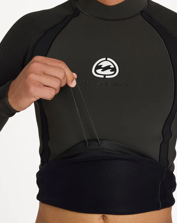 Billabong 1mm Ultra Long Sleeve Wetsuit Vest in black on model from the front close up showing boardshort tag