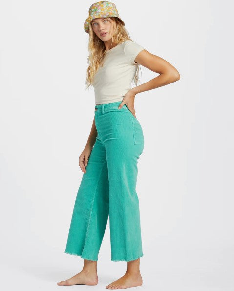 Billabong Free Fall Cord Women's Pants in bright lagoon colourway from side on model