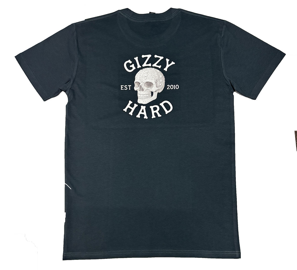 Gizzy Hard Kai On My Mind T-Shirt in petrol blue from the back, showing a skull made of a kina shell with bone lettering