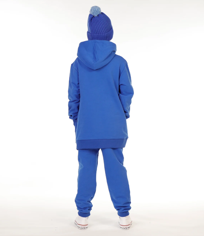 Hello Stranger Smiley Boys Pocket Hoodie in blue on model in blue hello stranger trackpants from the back