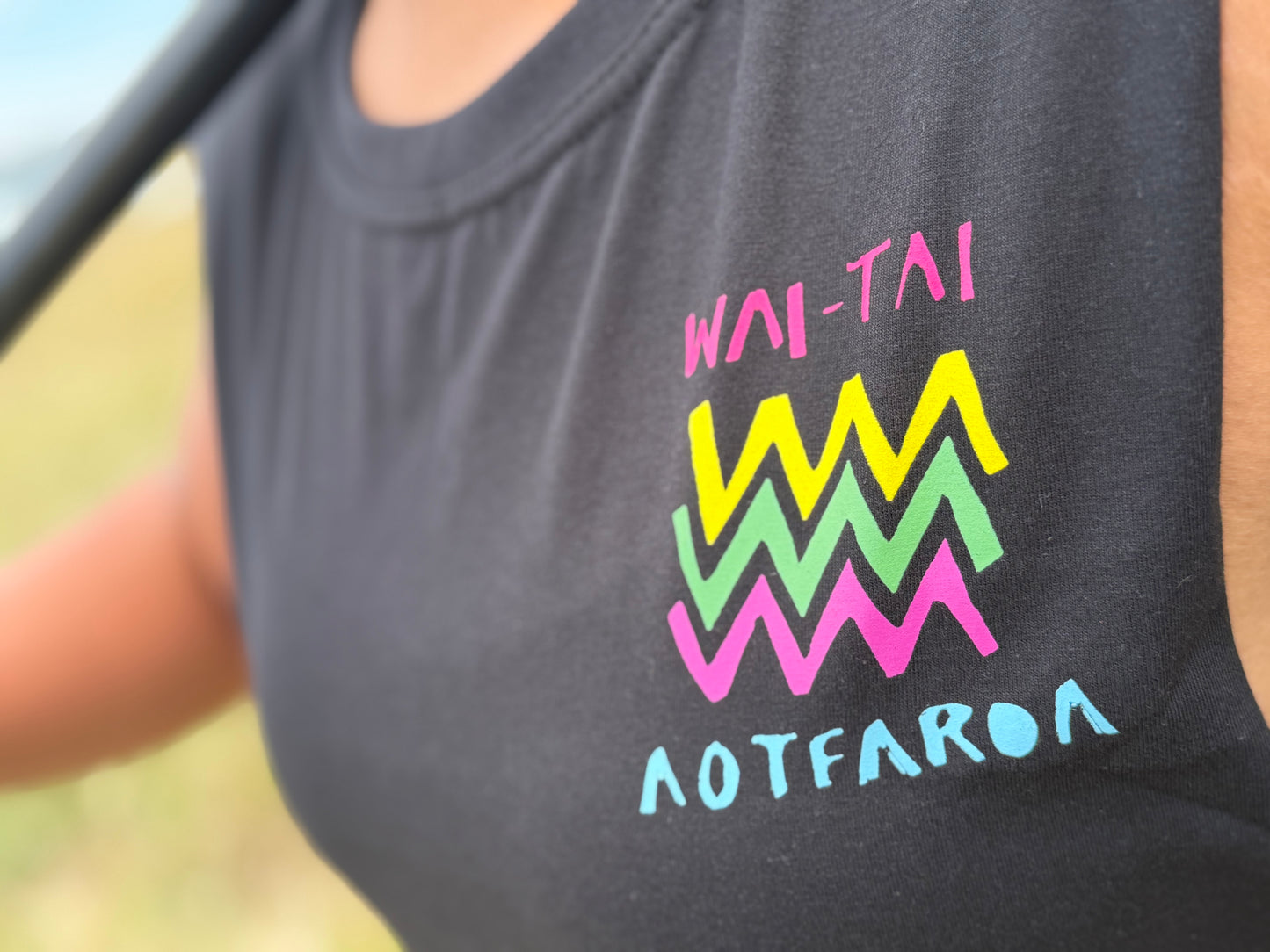 Wai-Tai Aotearoa Ono Whitu Heavyweight Unisex Maori Design Muscle Tee in black on Hine Brooking from front
