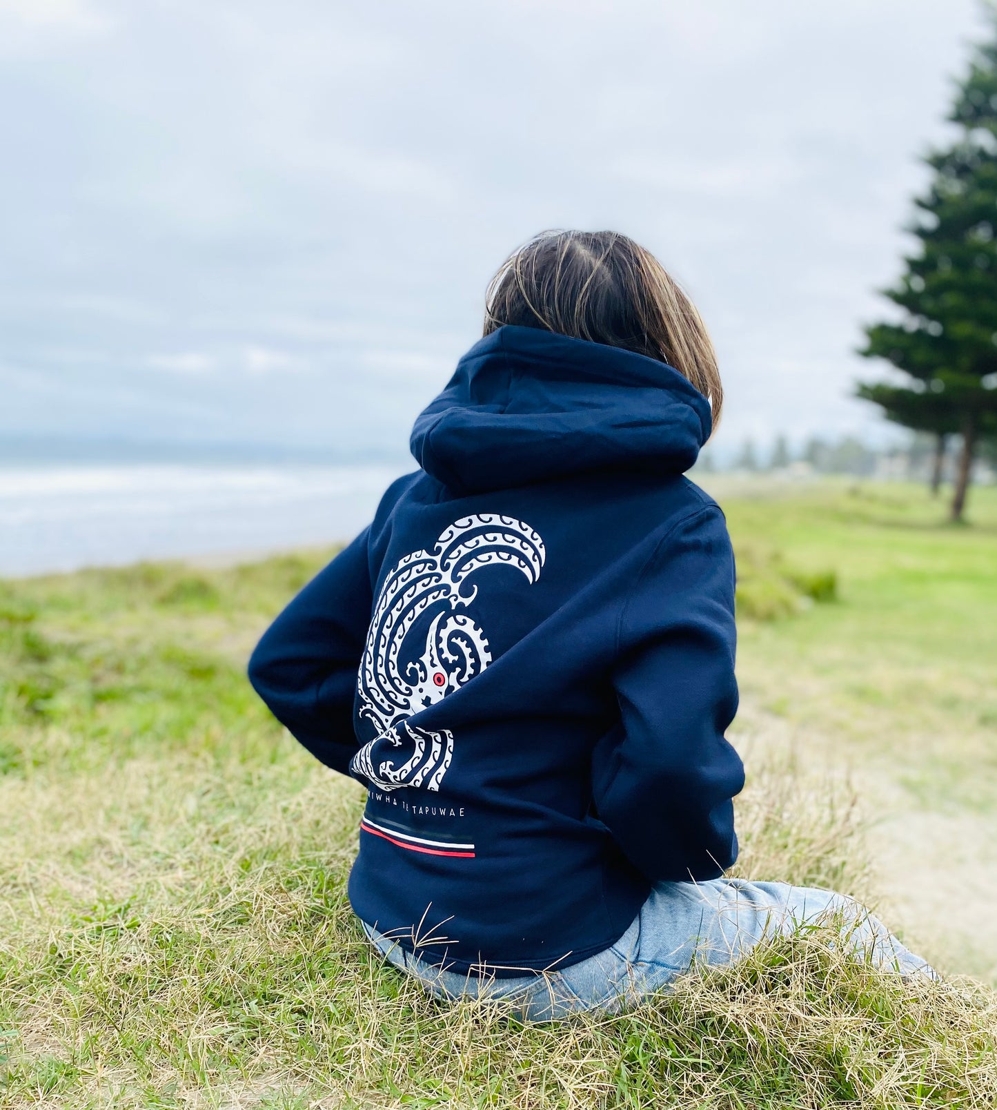 Wai-Tai Aotearoa Taniwha Maori Hoodie in navy colour showing taniwha print on back