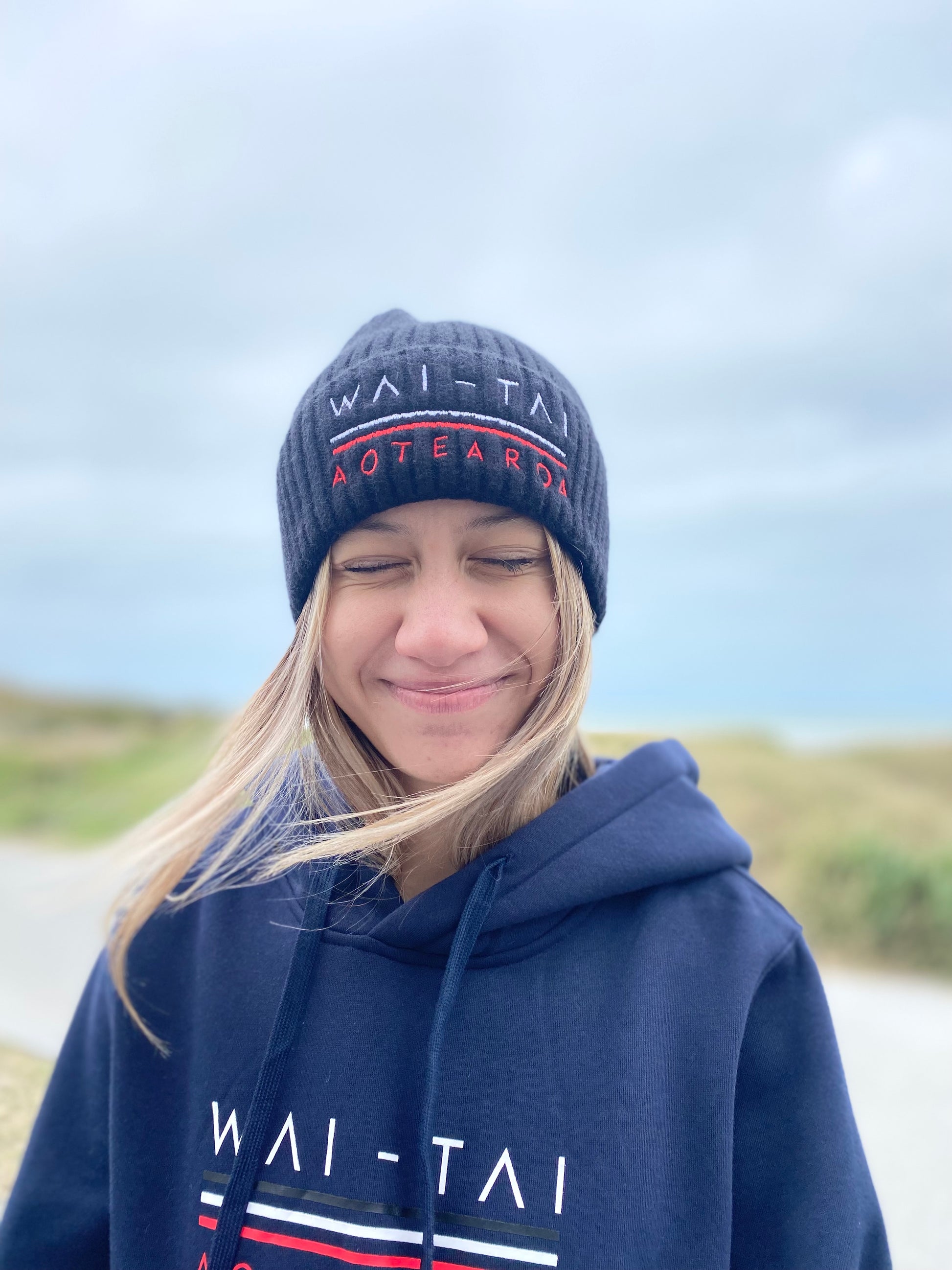 Wai-Tai Aotearoa Tohu Fisherman Beanie in black on model from front