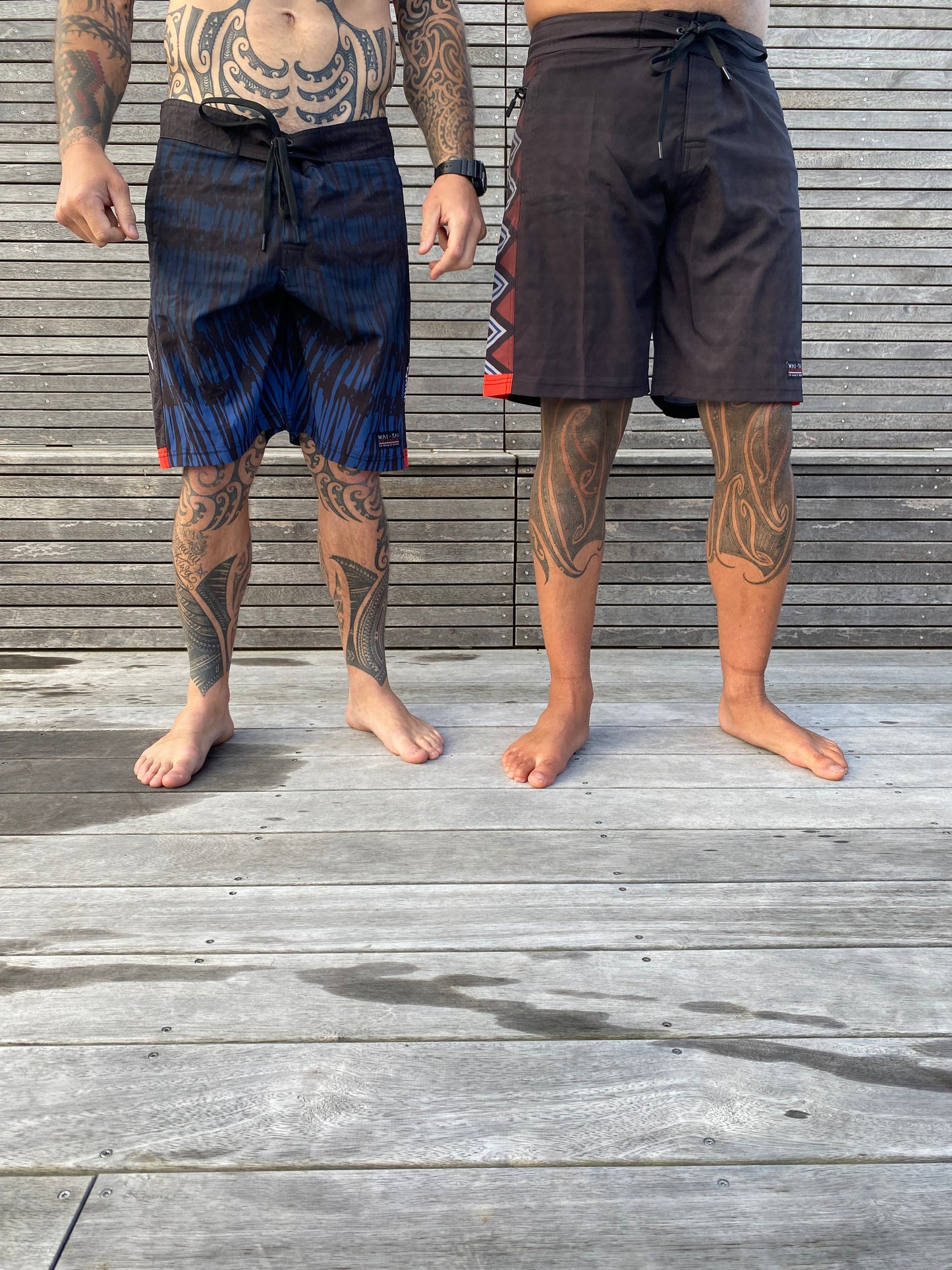 Wai-Tai Aotearoa Piu and Taniwha Maori boardshorts side by side from front