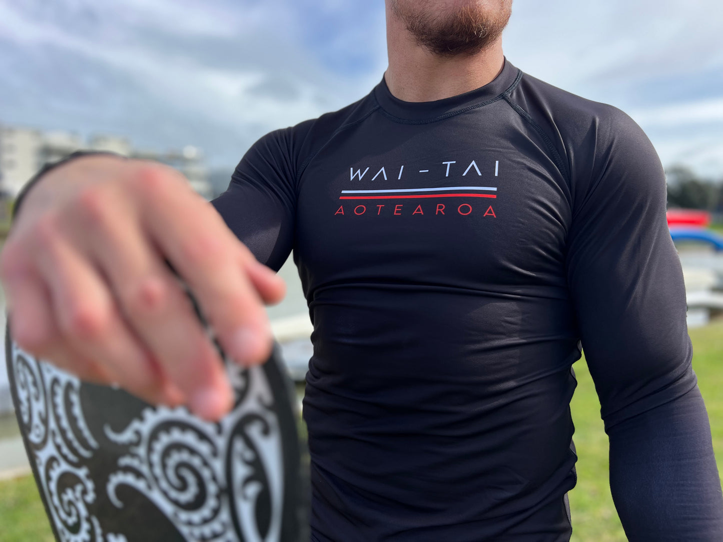 Wai-Tai Aotearoa Patiki Thermal Longsleeve Rash Top from front angle in black