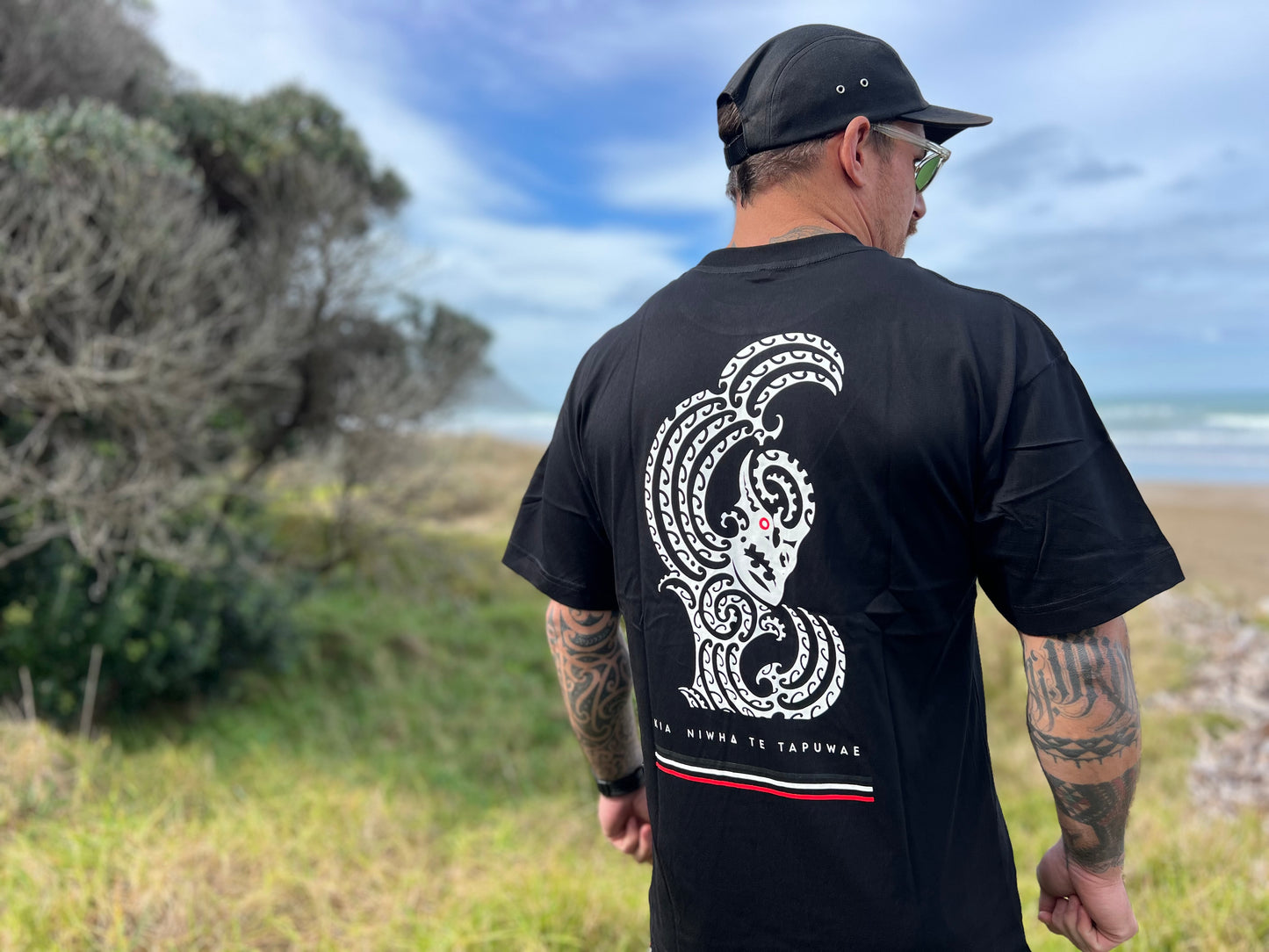 Wai-Tai Aotearoa Taniwha Maori t-shirt worn by Maia Gibbs in Gisborne from the back