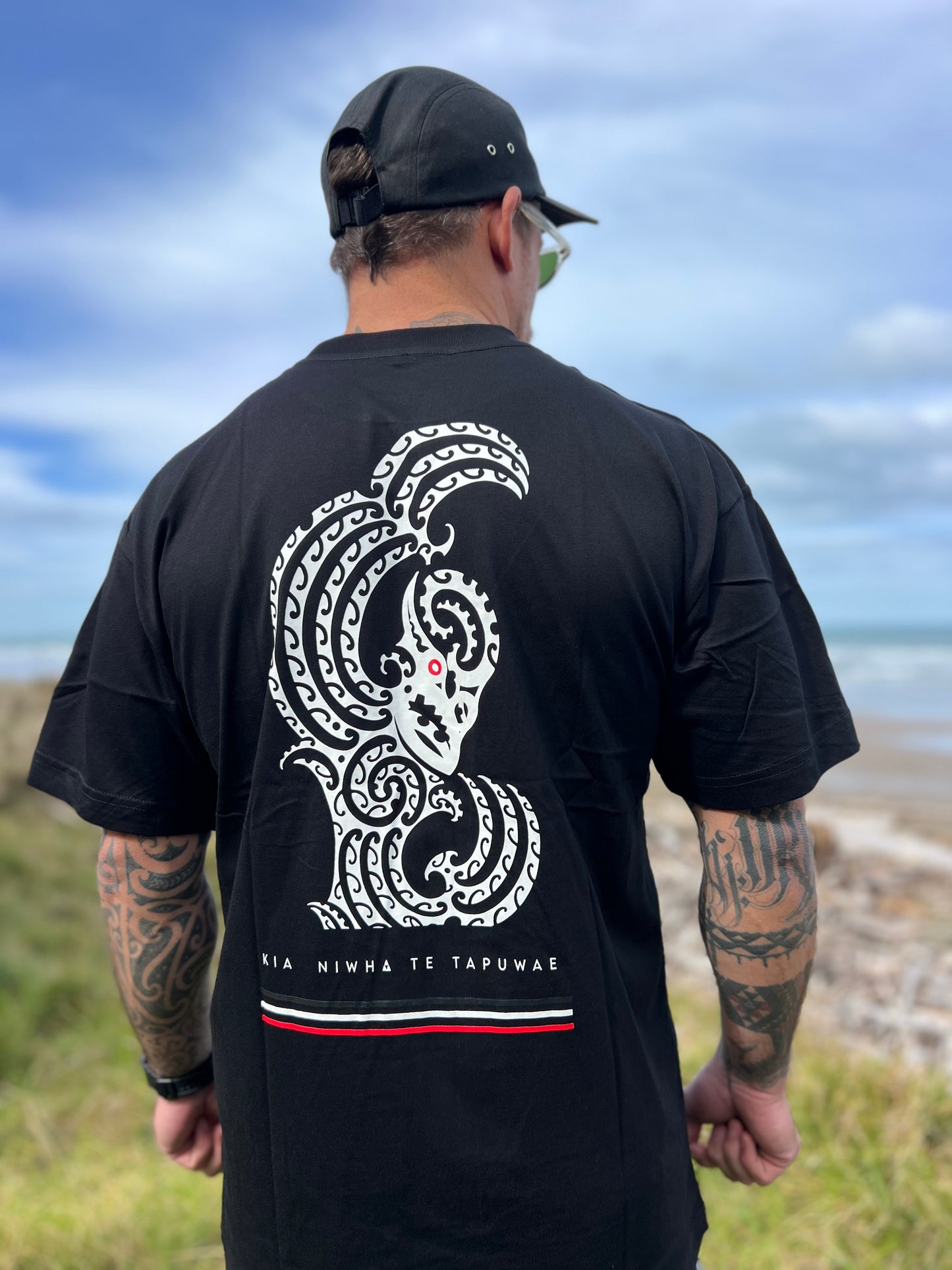 Wai-Tai Aotearoa Taniwha Maori t-shirt worn by Maia Gibbs in Gisborne from the back
