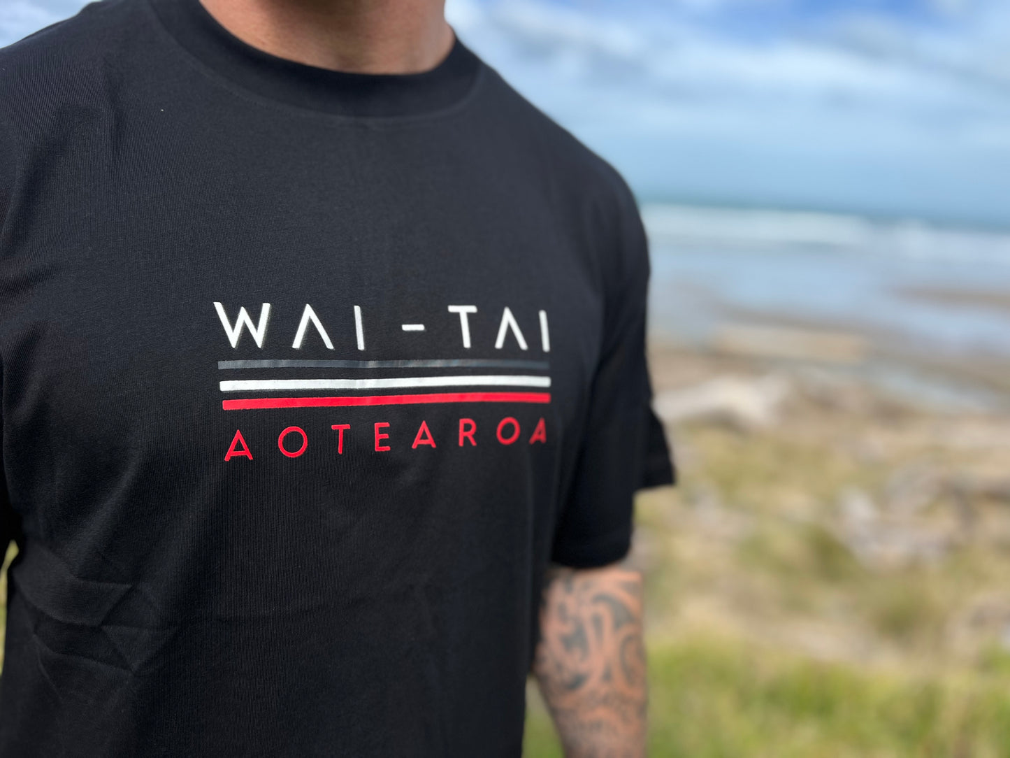 Wai-Tai Aotearoa Taniwha Maori t-shirt worn by Maia Gibbs in Gisborne from the front