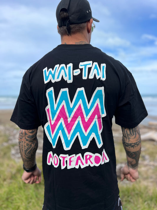 Wai-Tai Aotearoa Mura heavyweight Maori t-shirt in black with flouro print on Maia Gibbs from the back view