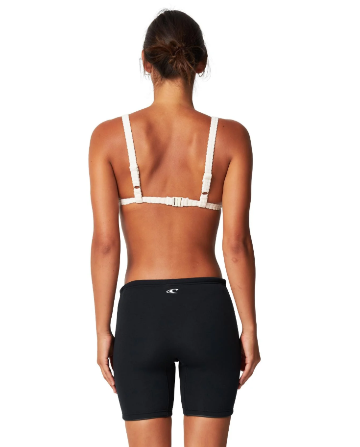 O'Neill Womens Reactor II 1.5mm Wetsuit Shorts in black on model in white bikini top from rear
