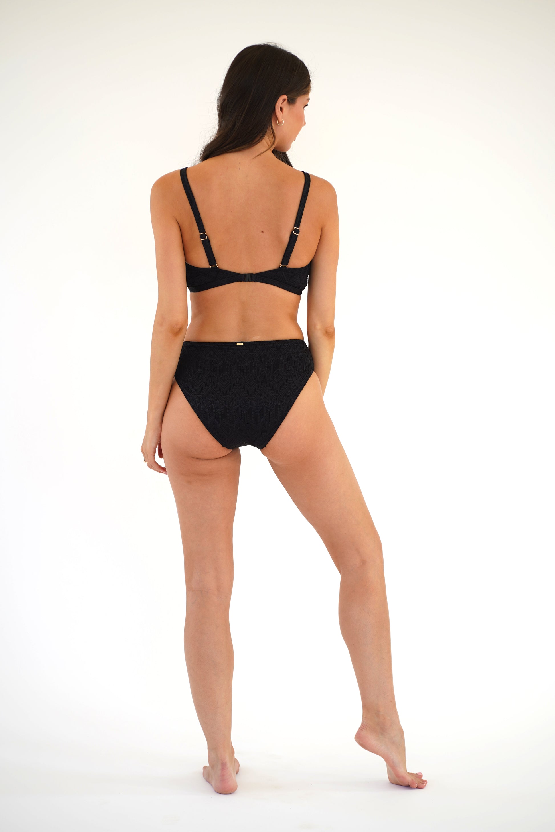 Piha Underwire Sport Tri D/DD with Mid Line Pant Bikini in black on dark-haired model from from rear