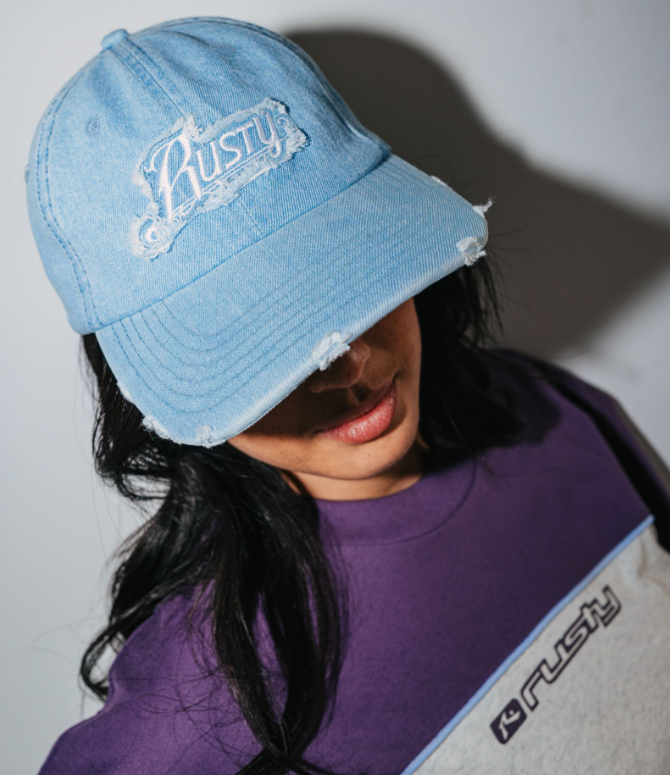 Rusty Beta Denim Women’s Dad Cap in sky blue on ladys head