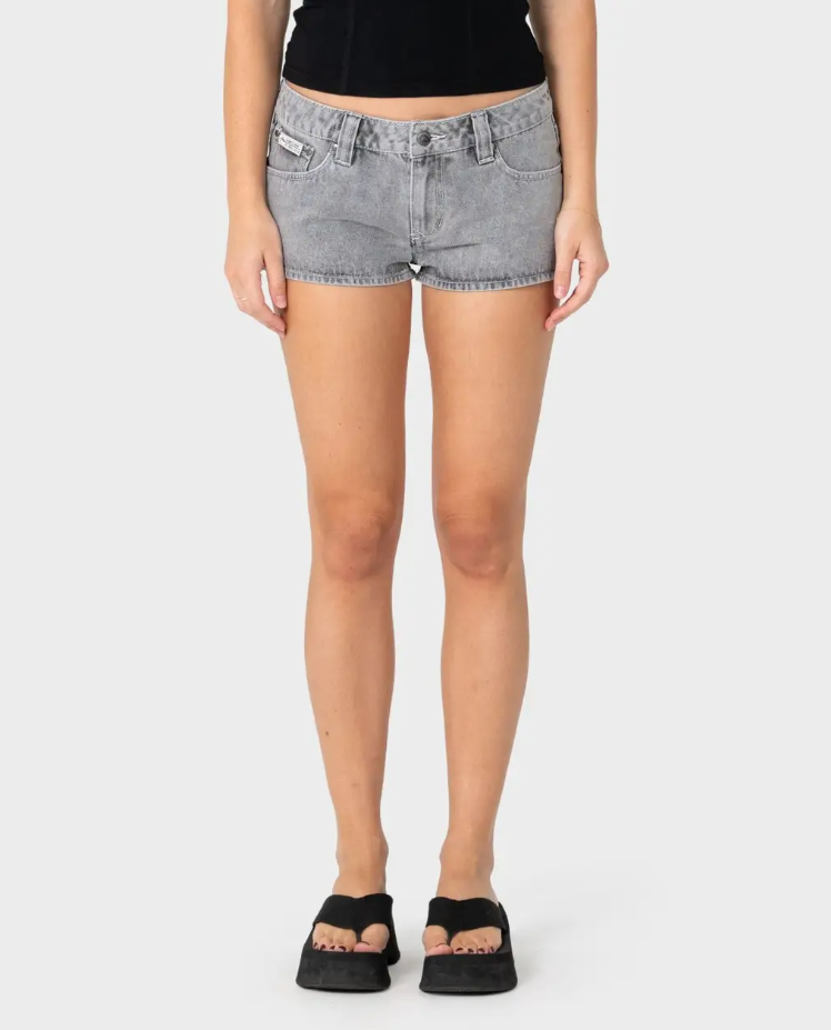 Rusty Punch Low Rise Micro Mini Denim Shorts in london summer colourway on model in black tank from the front close up
