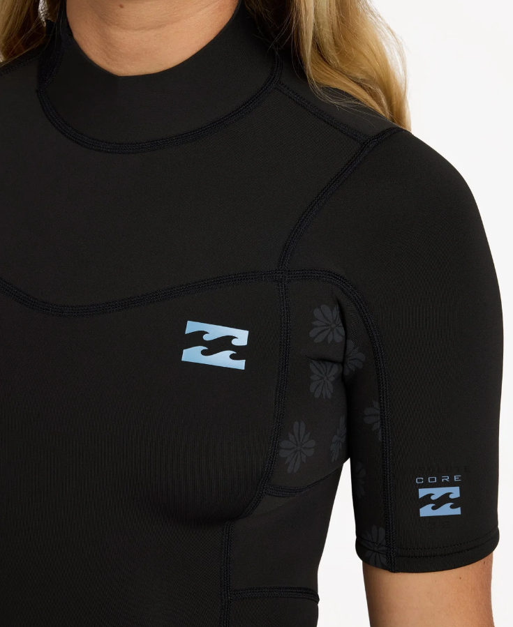 Billabong Absolute Core 2mm Spring Womens Wetsuit in black on model from the front showing left chest logo close up