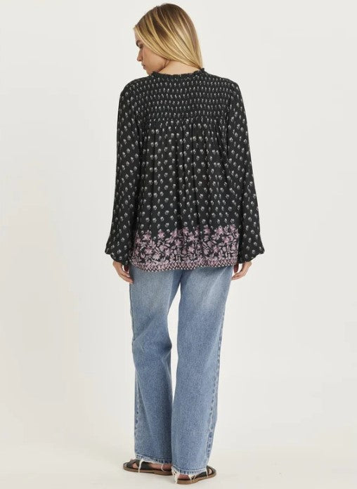 Amuse Society Mantra Long Sleeve Woven Shirt in black on model in blue jeans from rear