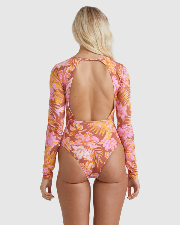 Blonde model wearing the Billabong Copacabana Bodysuit in brown from the back