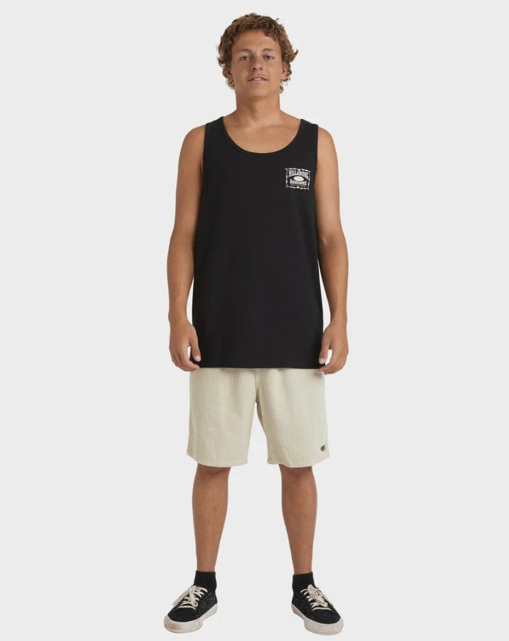 Billabong Double Spread Tank in black on model from the front wearing light coloured shorts