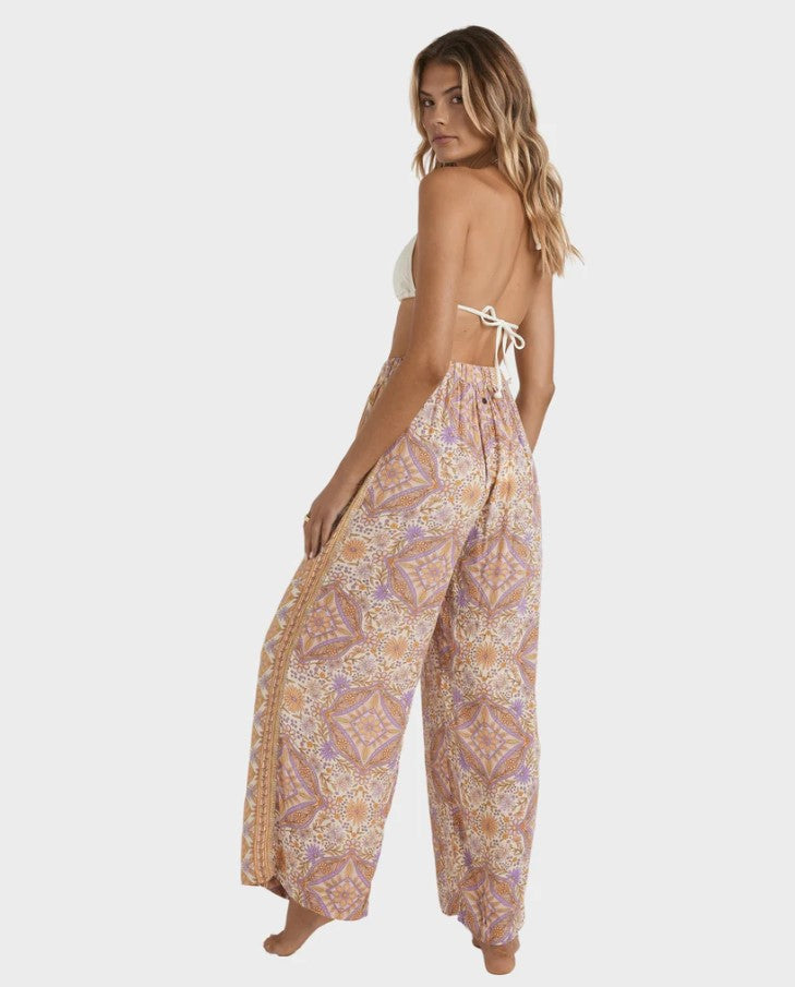 Billabong Just For You Follow Me Pants in sunstone floral colourway on model from rear