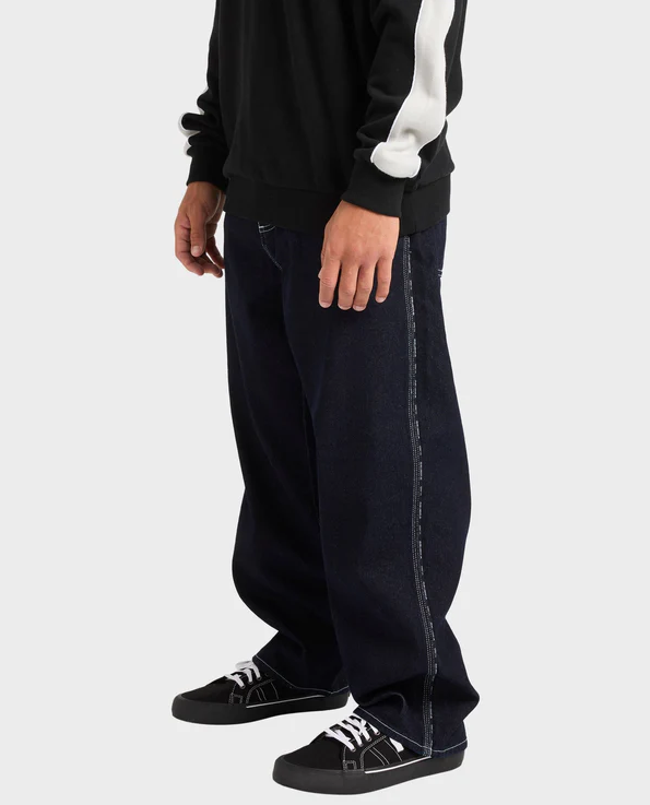 Billabong Spec 73 Chrome Denim Jeans in black on model close up from side