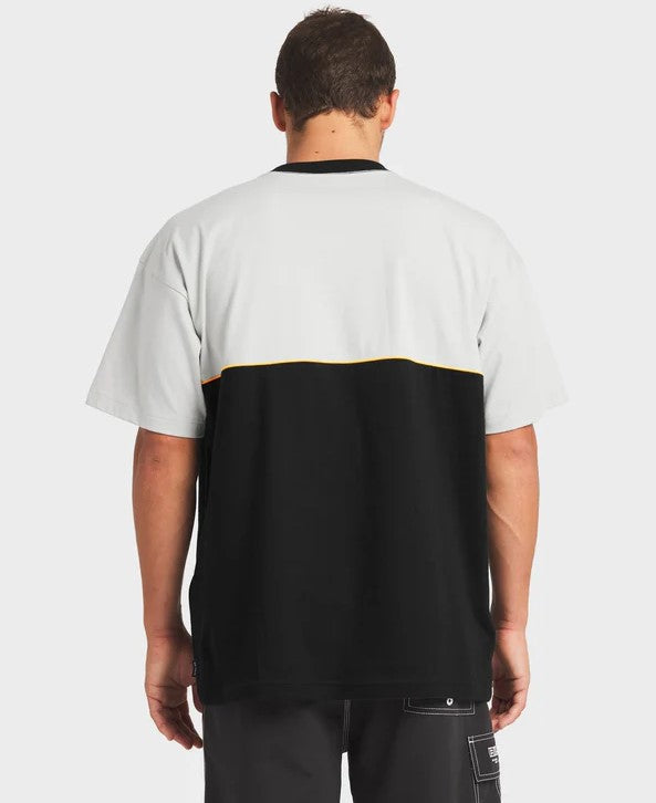 Billabong Spec Legacy OG T-Shirt in silver and black on male in charcoal boardshorts from rear
