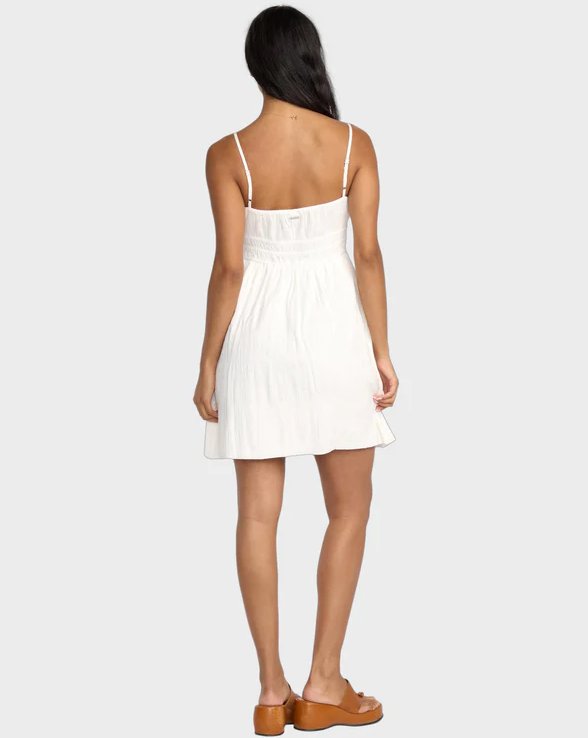 Billabong Sweet On You Mini Dress in salt crystal white on dark-haired model from rear view