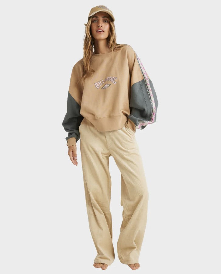cream brown crew with white&pink taping on arms and half grey bottom sleves and billabong print in middle of