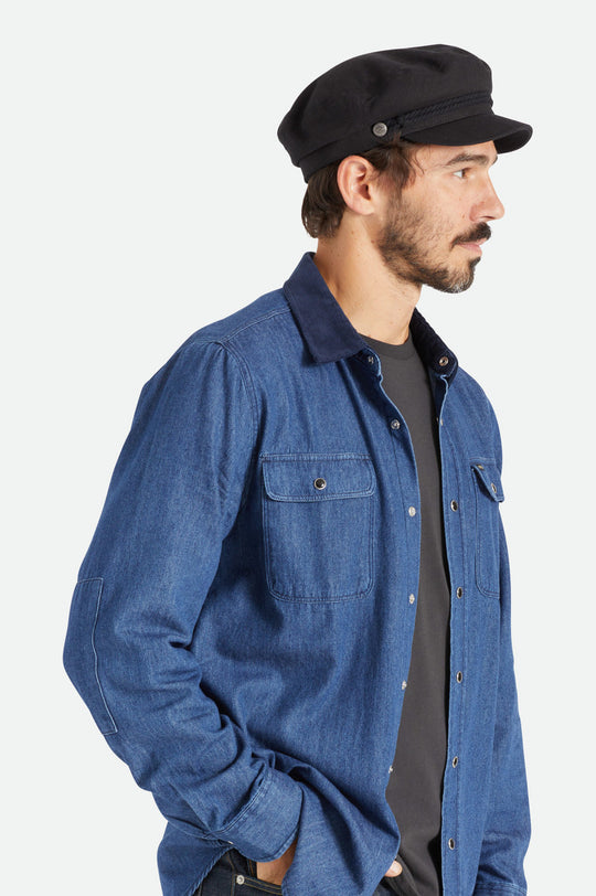 Brixton Fiddler Cap in black on male model
