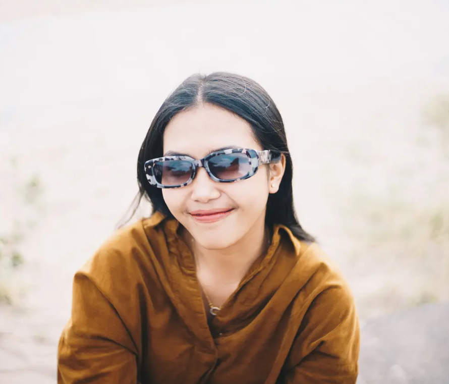 CHPO Brand Nicole Sunglasses in dalmation colourway on model in khaki top