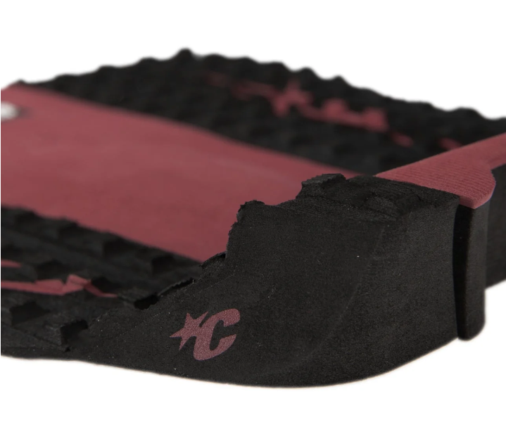 Creatures of Leisure Punish 3 Surfboard Grip in dark rose and black colourway from angle behind kick tail
