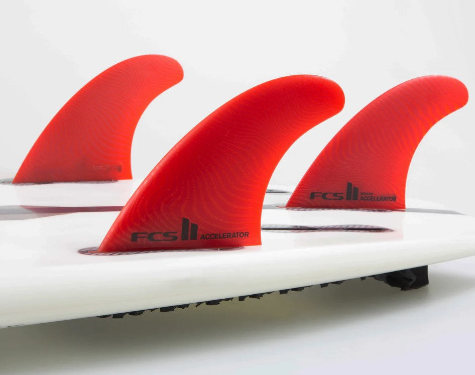 FCS II Accelerator Neo Glass Large Tri Fin Set in red in board