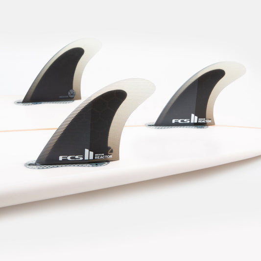 FCS II REACTOR PC LARGE TRI FIN SET showing three fins in board in charcoal and black colourway