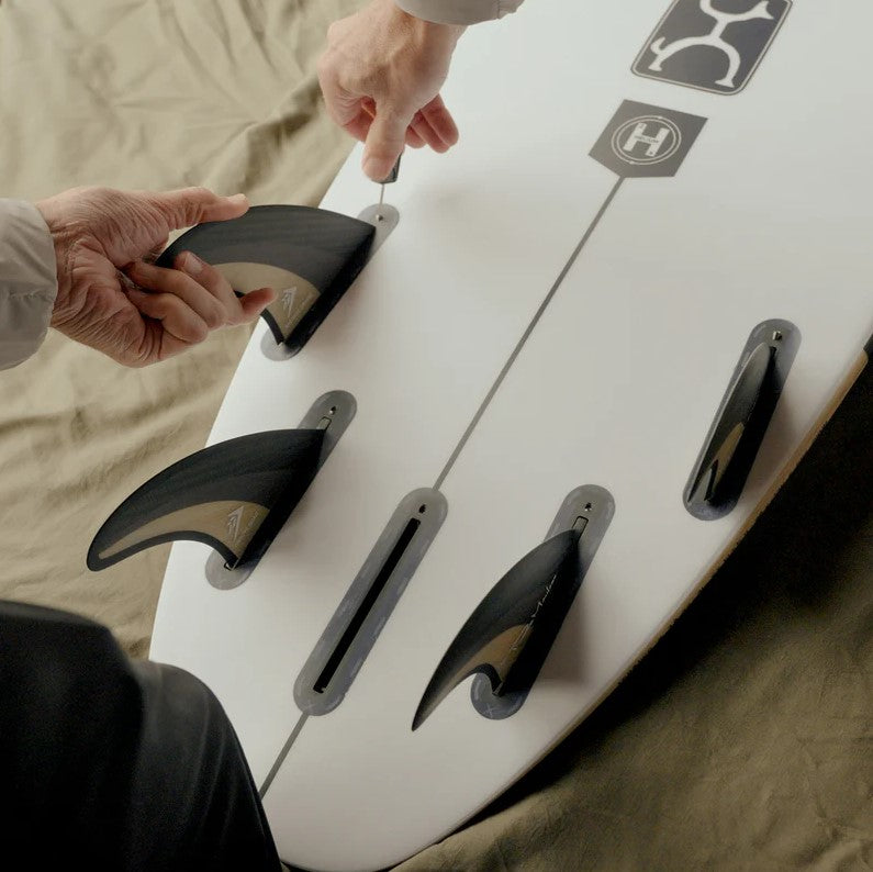 Firewire Machado The Groove 5 Surfoard Fin Set - Futures Base showing quad set in the tail of a surfboard