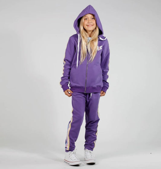 Hello Stranger Girls Sunset Trackpants in purple on model wearing purple hoodie