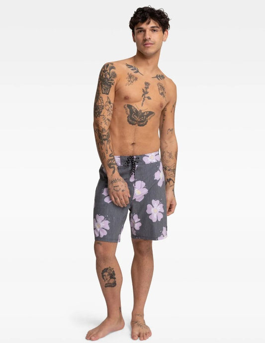 Model wearing the Hurley Icon Drips Boardshorts in black with purple flowers