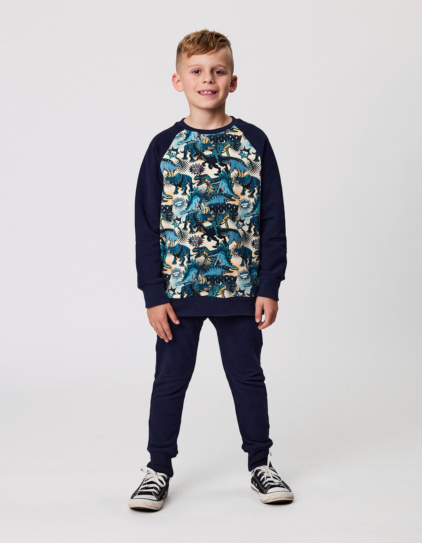 Radicool Kids Dinos Raglan Crew in navy arms ith dinosaur print from front