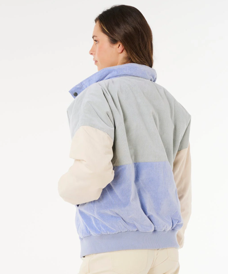 Rip Curl Cala Vadella Women's Corduroy Jacket in sage colourway with sky blue and off white panels from rear on model