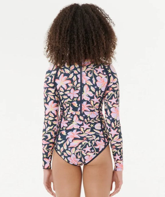 Rip Curl Sunset Skies Girls LS Surfsuit in navy floral colourway on model from rear