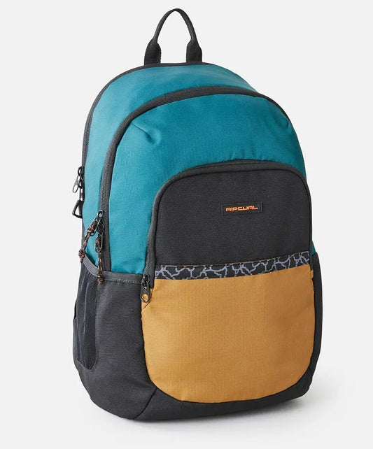 Rip Curl Ozone 33L Journeys Backpack standing alone from side in blue green