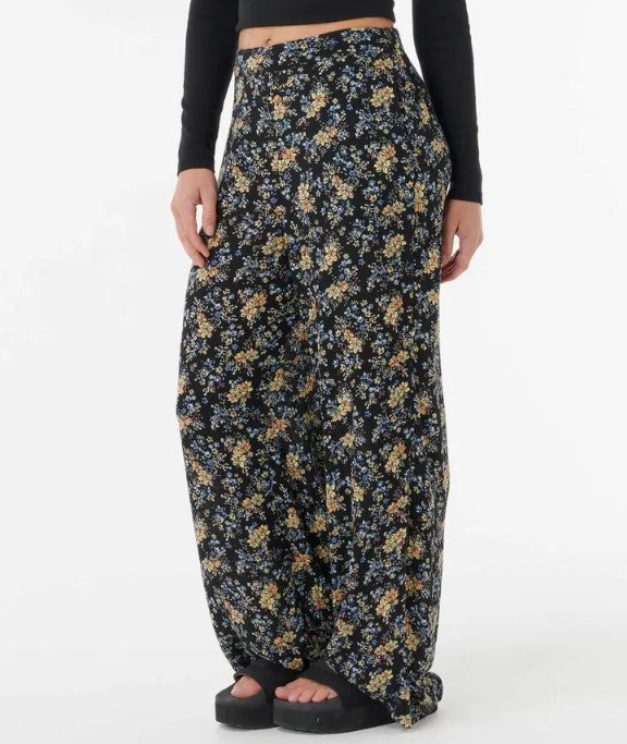 Rip Curl Pacific Rider Ditsy Pants in black based floral close up from side/front view