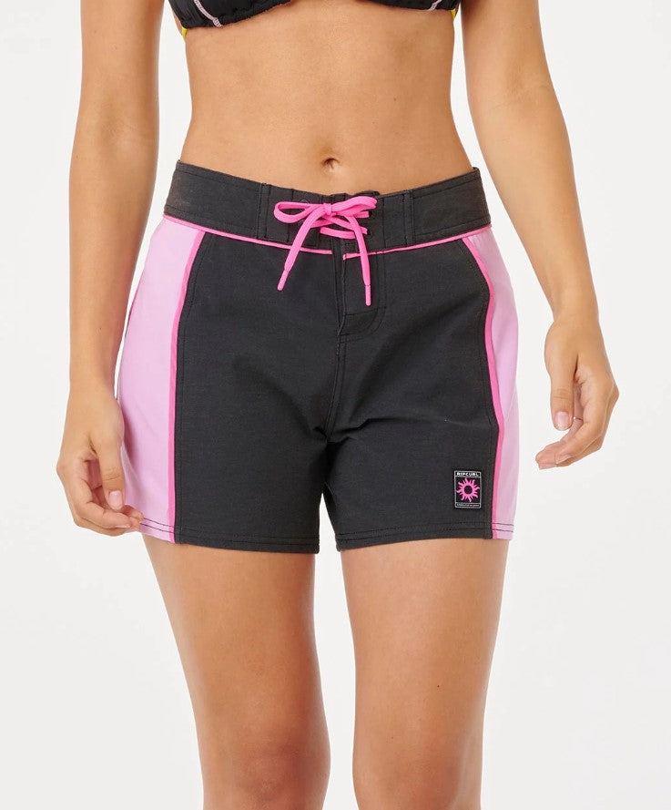 Rip Curl SG Spliced 5" Boardshorts in black and pink on model from front