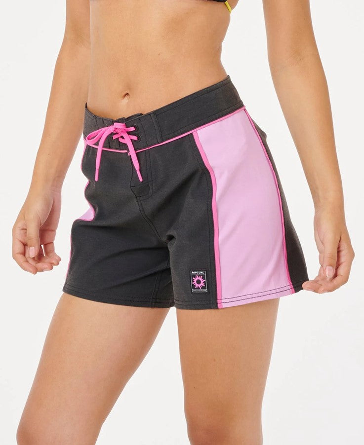 Rip Curl SG Spliced 5" Boardshorts in black and pink on model from side