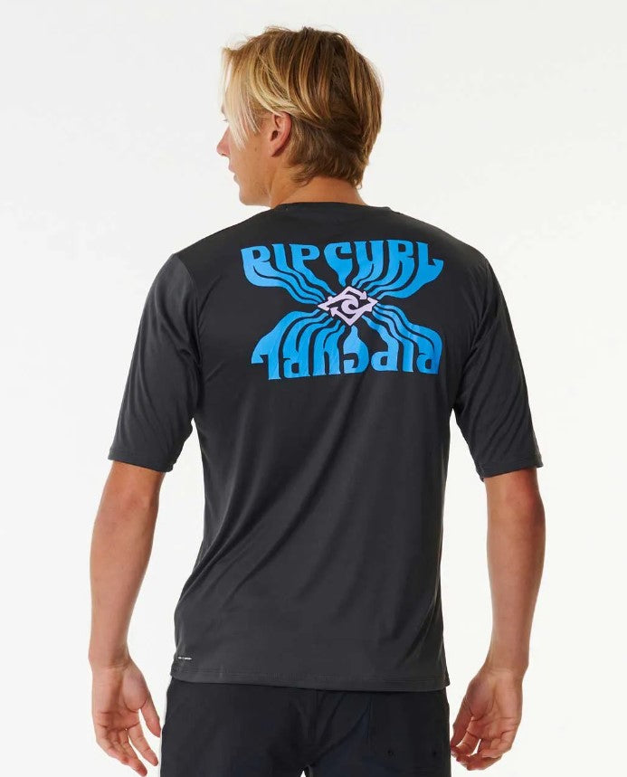 Blond model wearing Rip Curl SWC Solar Surflite UPF Men's S/S Rash Tee from back in washed black colour