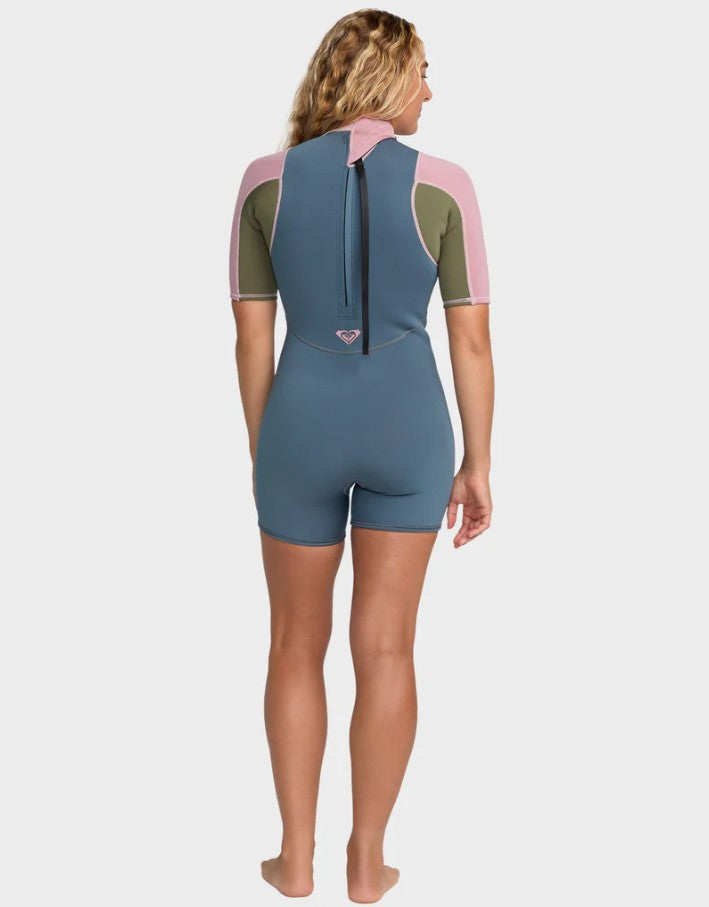 Roxy Prologue 2mm Spring Womens Wetsuit in ash blue with pink on blonde model from rear